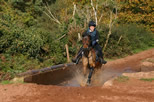 Pony and rider - cross country through water
